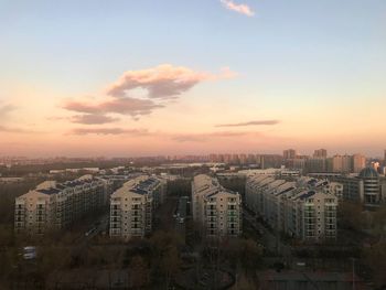 High angle view of buildings against sky during sunset