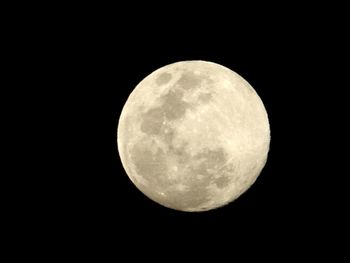 Low angle view of moon against clear sky at night