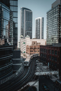 Modern buildings in city against sky