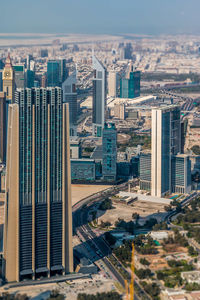 High angle view of buildings in city against sky