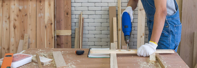 Low section of woman working at home