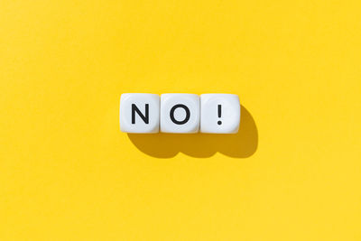 Close-up of text on yellow background