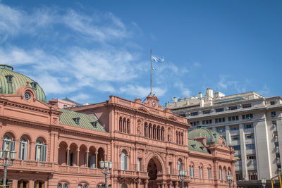 Low angle view of building against blue sky