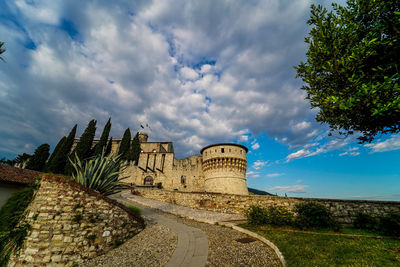 Old building against cloudy sky