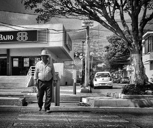 Full length of woman standing on city street