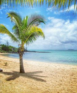 Scenic view of sea against cloudy sky