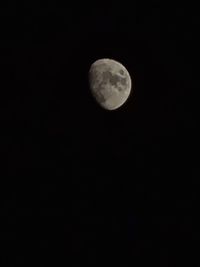 Low angle view of moon against sky at night