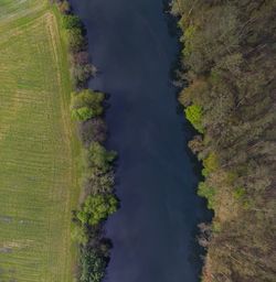 Aerial view of the navia river and its meadows in asturias, spain