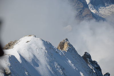 Scenic view of snow covered mountains