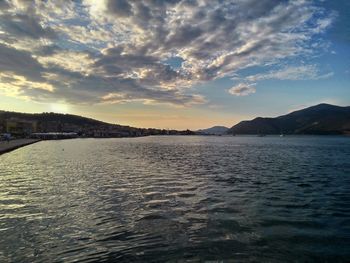 Scenic view of sea against cloudy sky