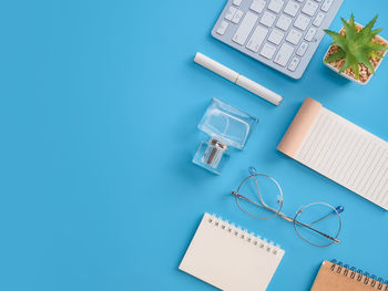 Directly above shot of objects on blue background