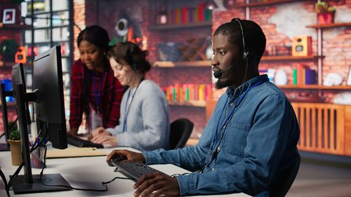 Portrait of young woman sitting on street