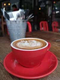 Coffee cup on table at cafe
