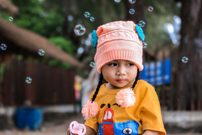 Close-up, cute little girl with simply outfit