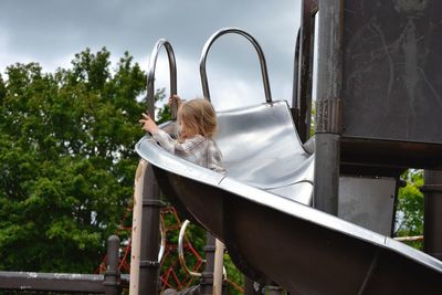 Girl coming down a helper skelter