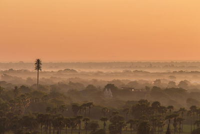 Scenic view of landscape against sky during sunset