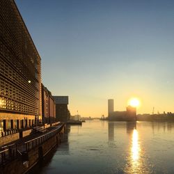 View of cityscape against clear sky during sunset