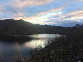 Scenic view of lake against sky during sunset