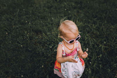 Girl standing in grass