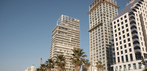 Low angle view of modern buildings against sky