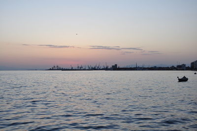 Scenic view of sea against clear sky during sunset