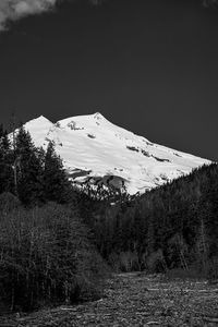 Scenic view of snowcapped mountain against sky