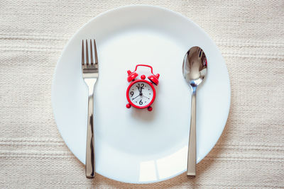 Directly above shot of clock on table