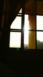 View of sunset through window