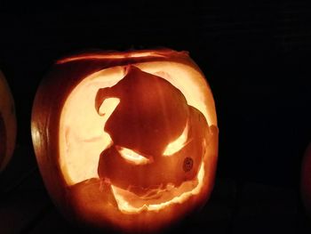 Close-up of illuminated pumpkin against black background