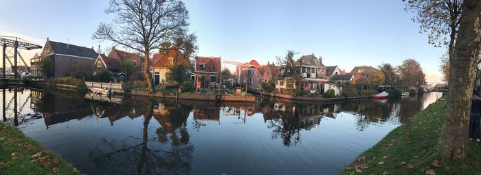 Reflection of buildings and trees in canal