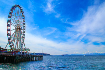 Ferris wheel against blue sky