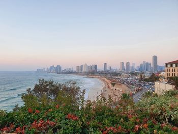 High angle view of townscape by sea against clear sky- tel aviv, israel