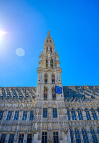 Low angle view of building against blue sky