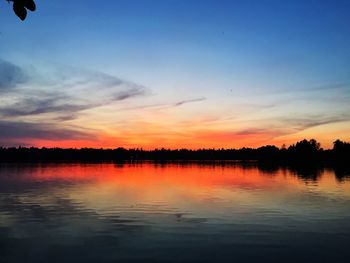 Scenic view of lake at sunset