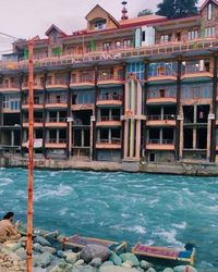 View of buildings by sea