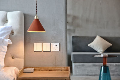 Electric lamp hanging on table at home