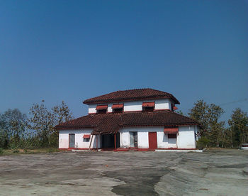 View of old building against clear blue sky