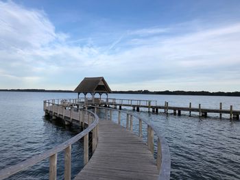 Pier over sea against sky