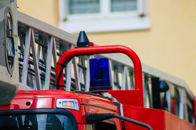 Close-up of vintage car against building in city