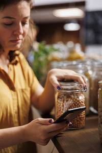 Young woman using mobile phone