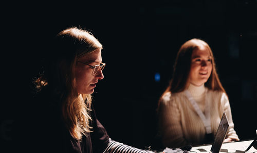 Young women sitting indoors