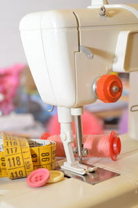 High angle view of tape measure with sewing items