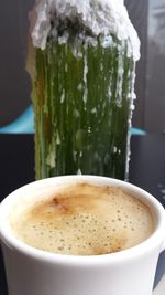 Close-up of cappuccino on table