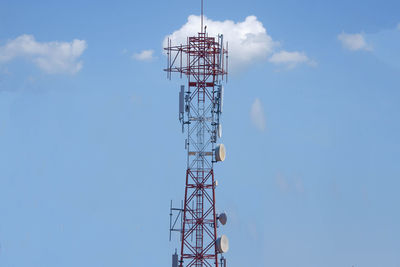 Low angle view of communications tower against sky