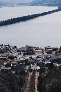 High angle view of buildings by sea