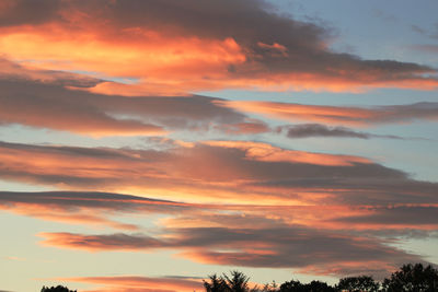 Low angle view of dramatic sky during sunset