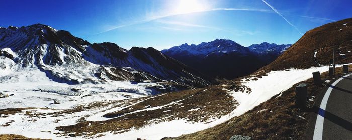 Idyllic view of snow covered mountains against sky