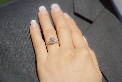 Close-up of woman hand showing engagement ring