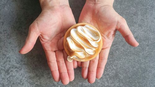 Midsection of person holding ice cream