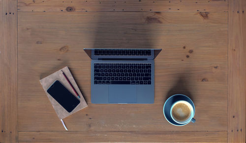 Directly above shot of coffee cup on table